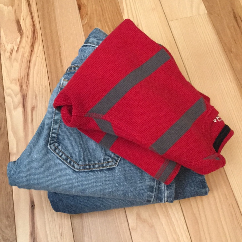 Two pairs of jeans and thermal shirt.